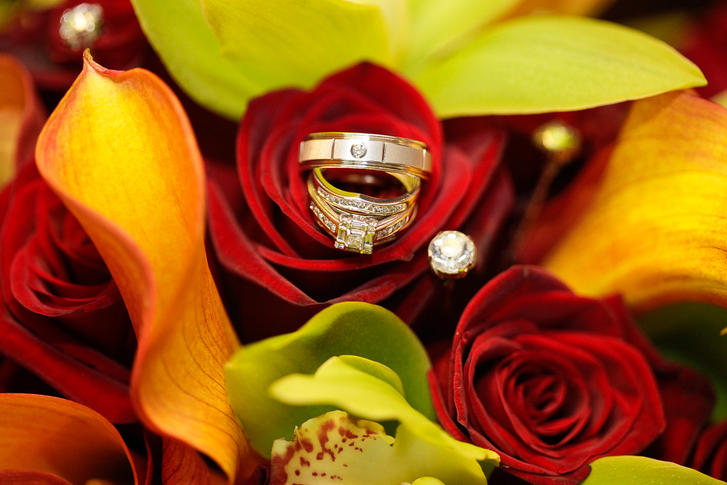Dallas Wedding Pictures ring in red roses bouquet